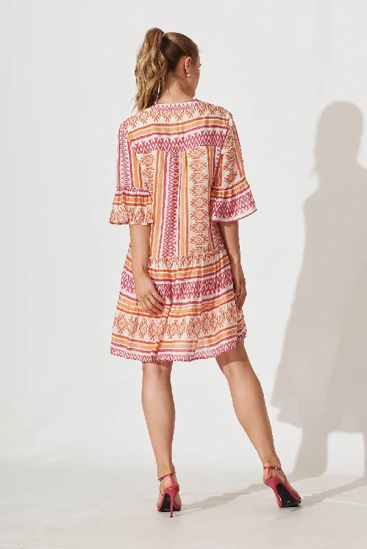 Tesoro Smock Dress In Pink And Orange Aztec Print